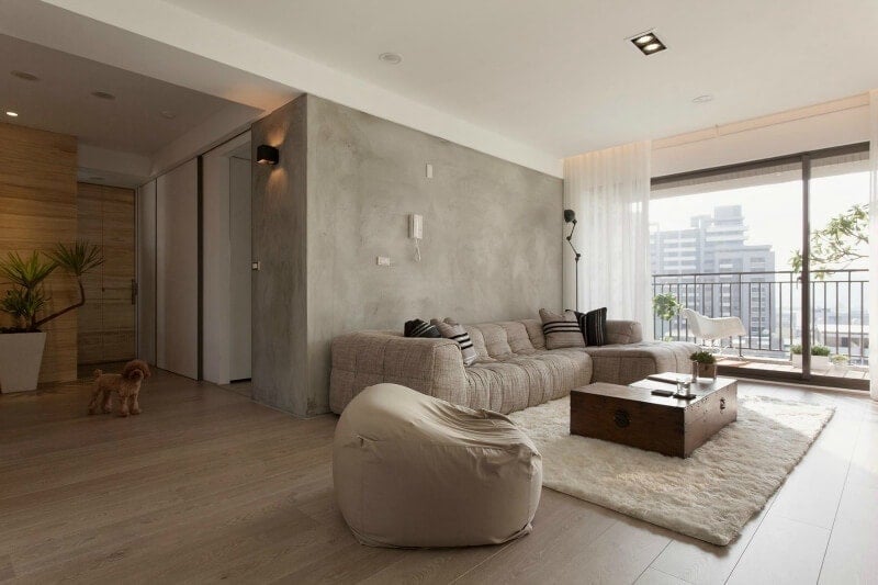 concrete effect feature wall in apartment living room
