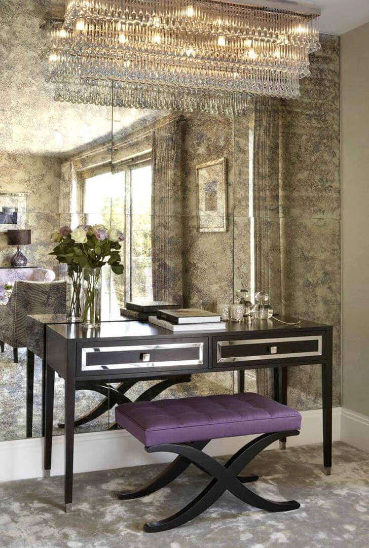 rusted mirror feature wall in dining room