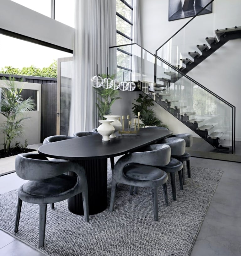 luxe dining room black oval dining table velvet dining chairs