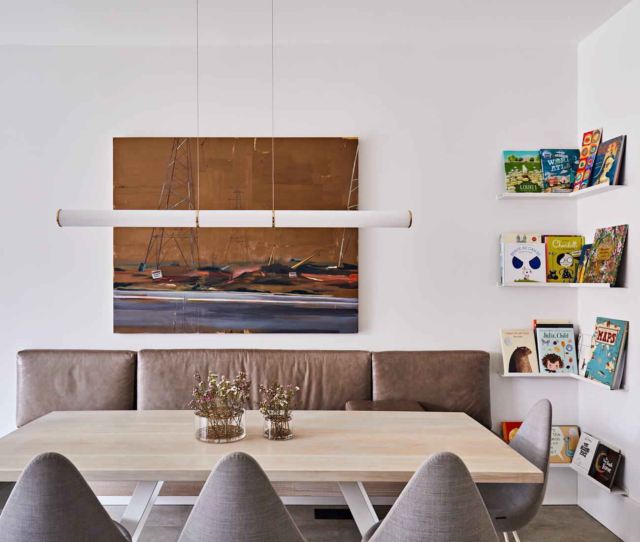 dark brown leather banquette seat against wall in dining room
