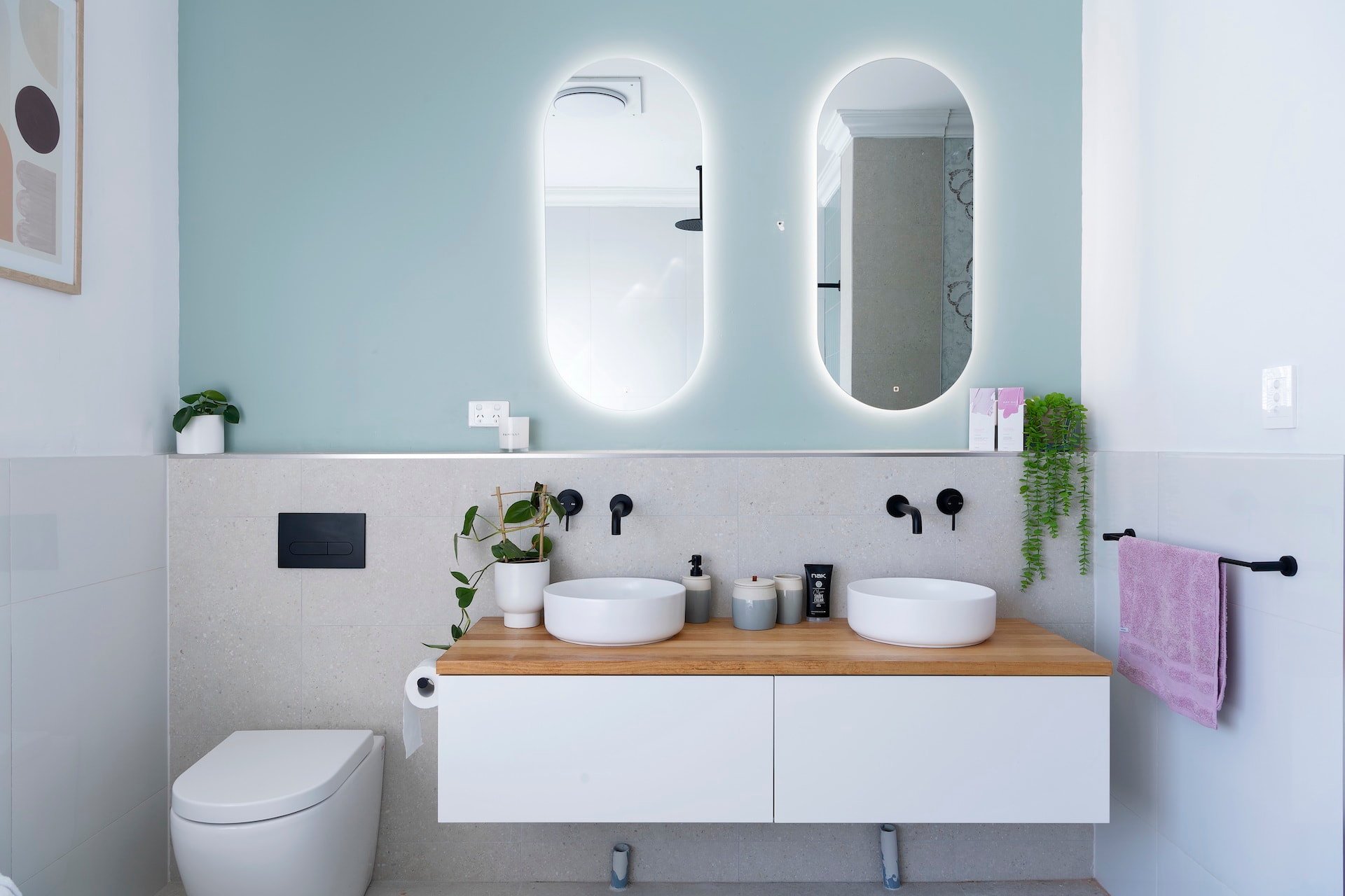 house rules 2020 tanya and dave reveal bathroom with twin oval mirrors and floating vanity