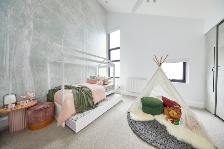 the block 2020 sarah and george upstairs kids bedroom with forest wallpaper and white house bed