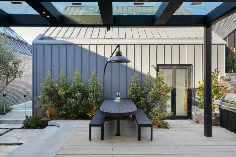 the block 2020 george and sarah curved outdoor dining table in backyard