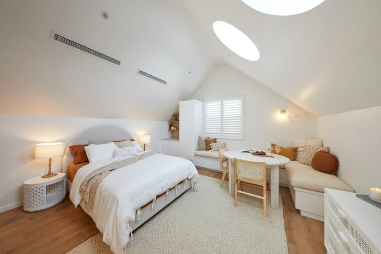 the block 2020 luke and jasmin studio with bed and banquette seating