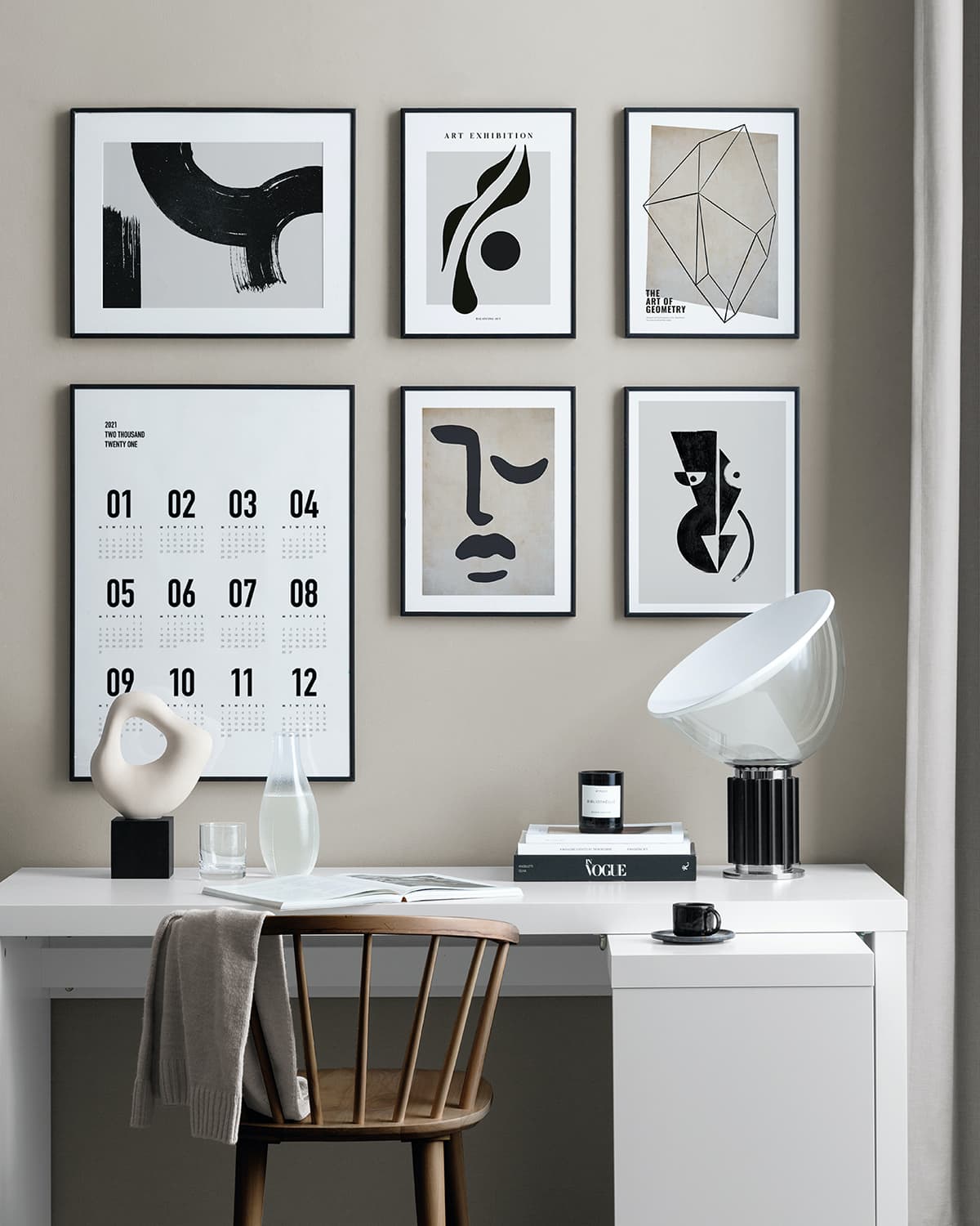 desenio art black and white gallery wall on beige painted wall in home office