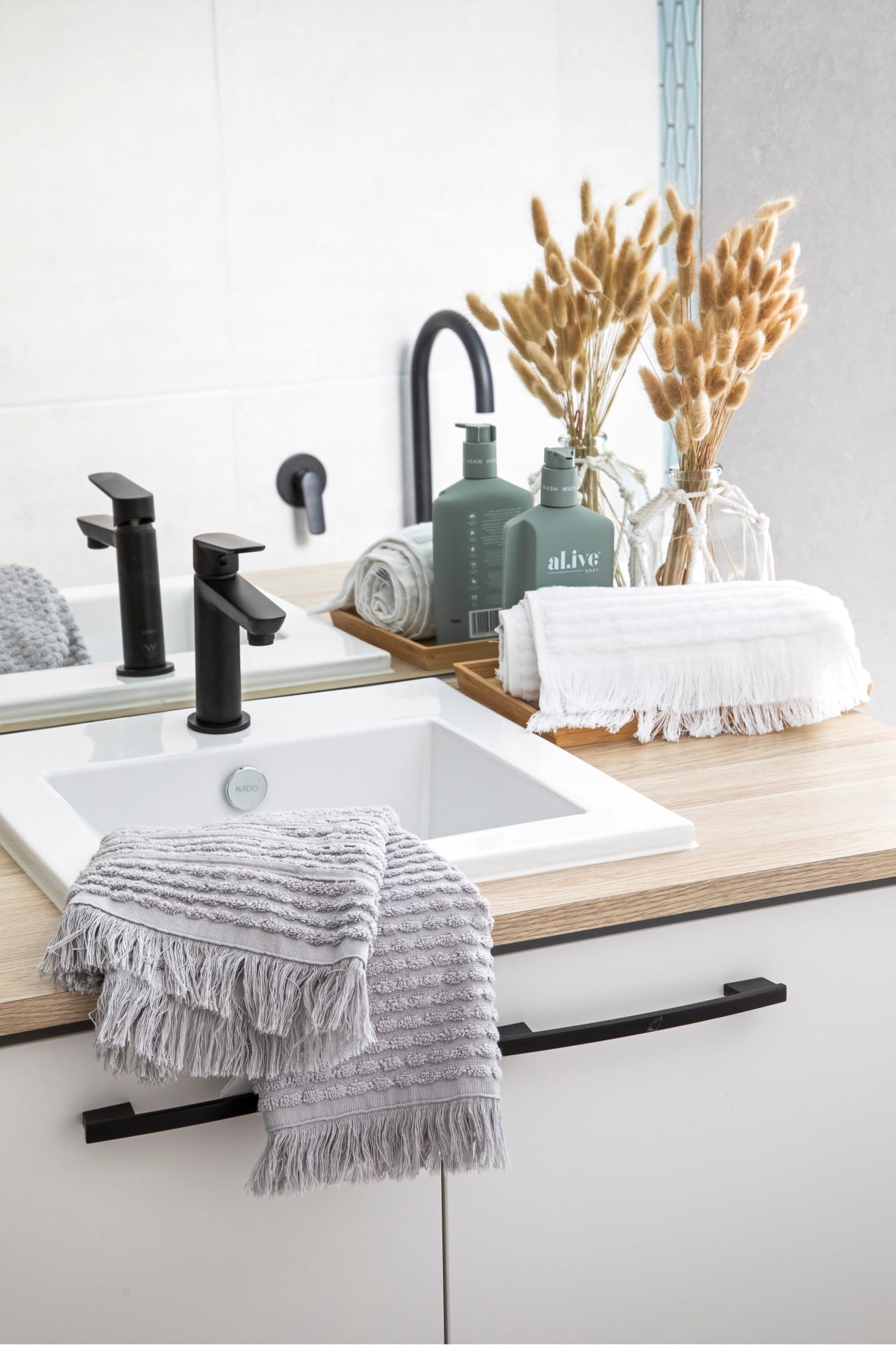 neutral bathroom timber top vanity white basin matt black bathroom tap grey fringe towel