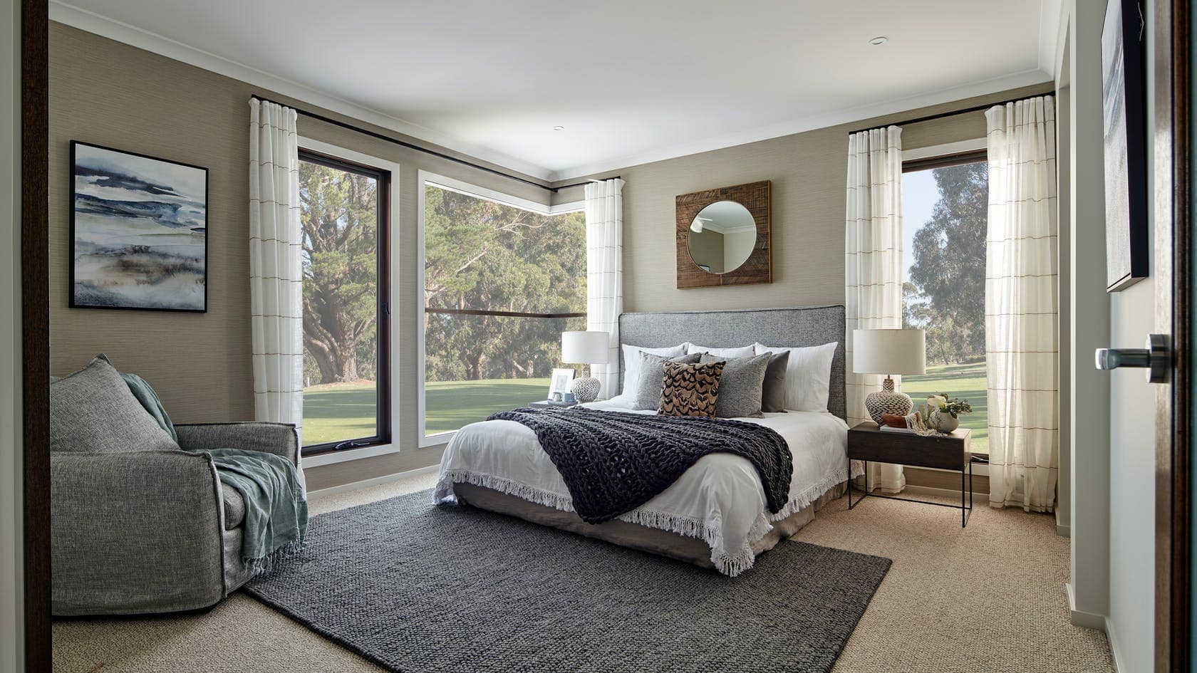 centre open striped sheer curtains on black track in master bedroom