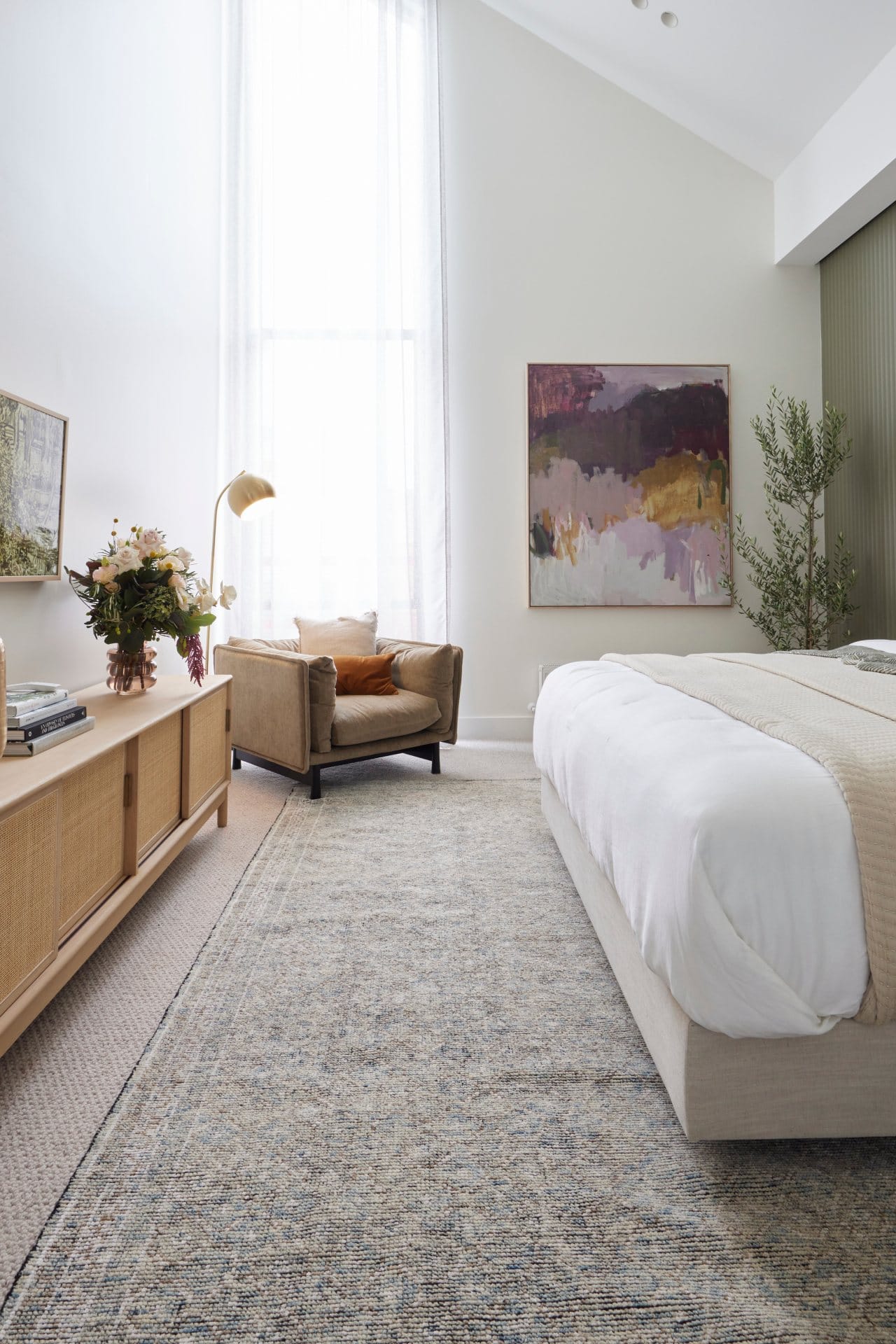 the block 2021 ronnie and georgia master bedroom art and armchair