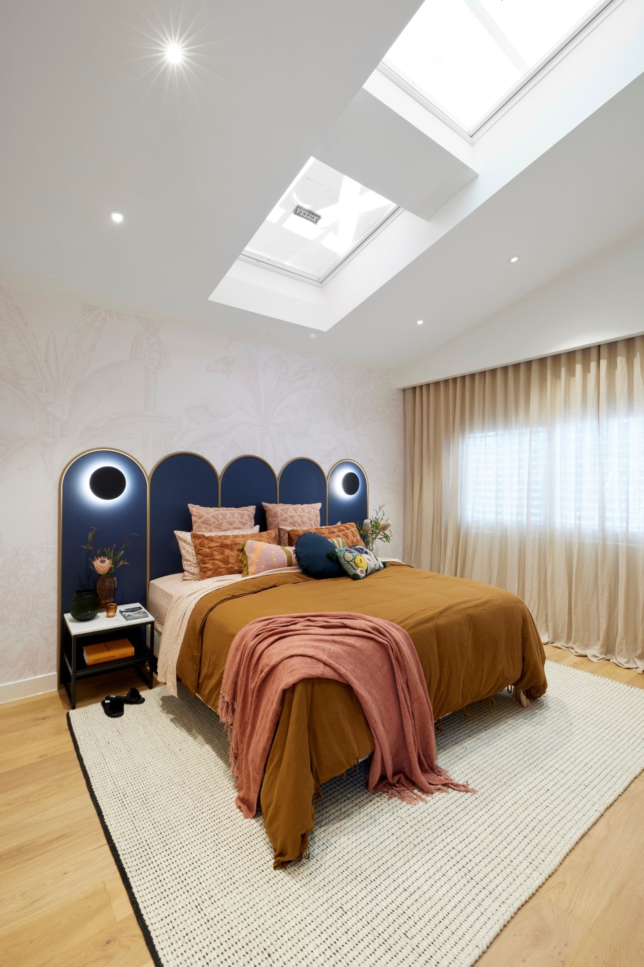 the block 2021 tanya and vito master bedroom blue arched headboard