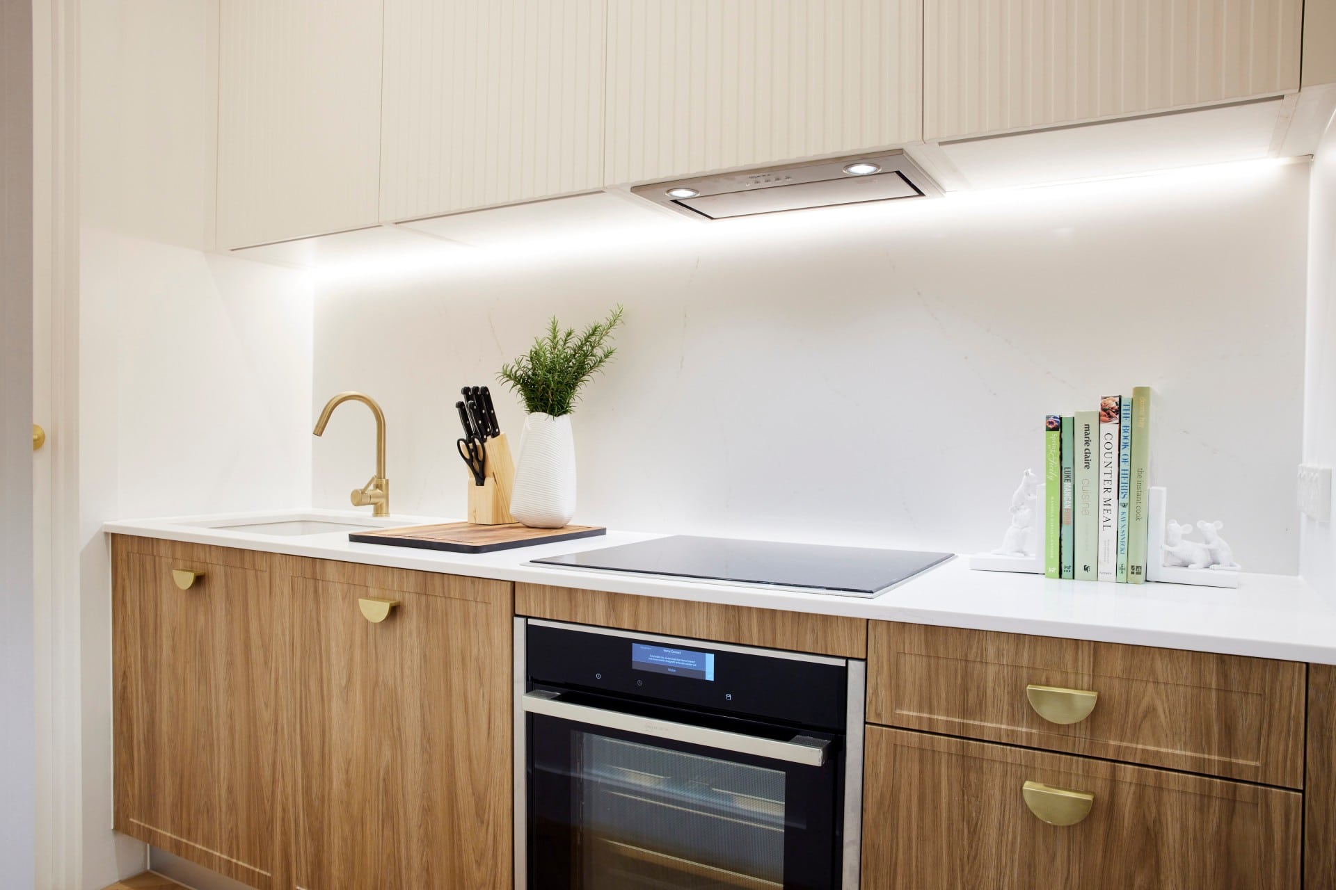 the block 2021 mitch and mark butlers pantry with brown cabinets and brass handles