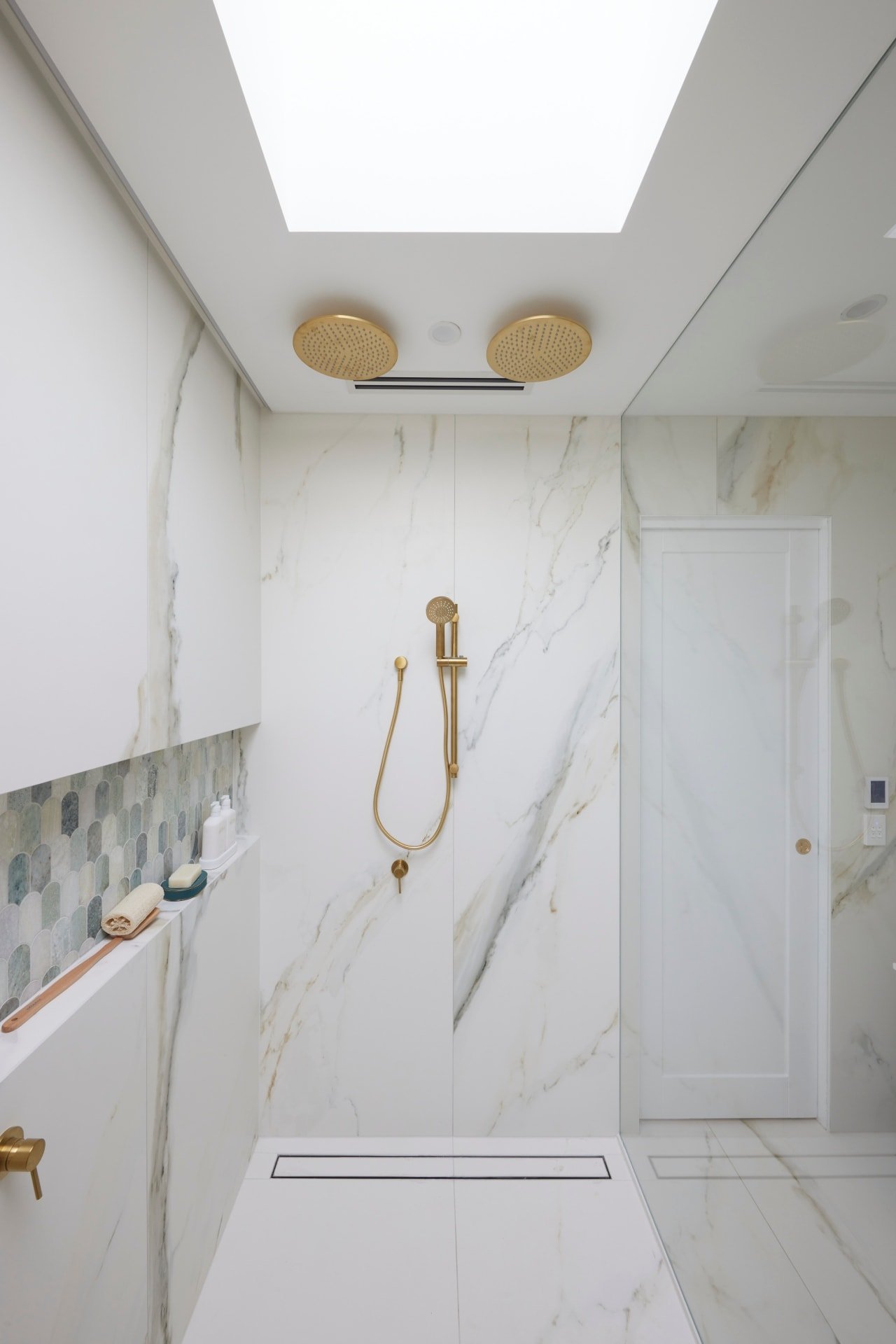 the block 2021 mitch and mark master ensuite shower with brass double shower heads