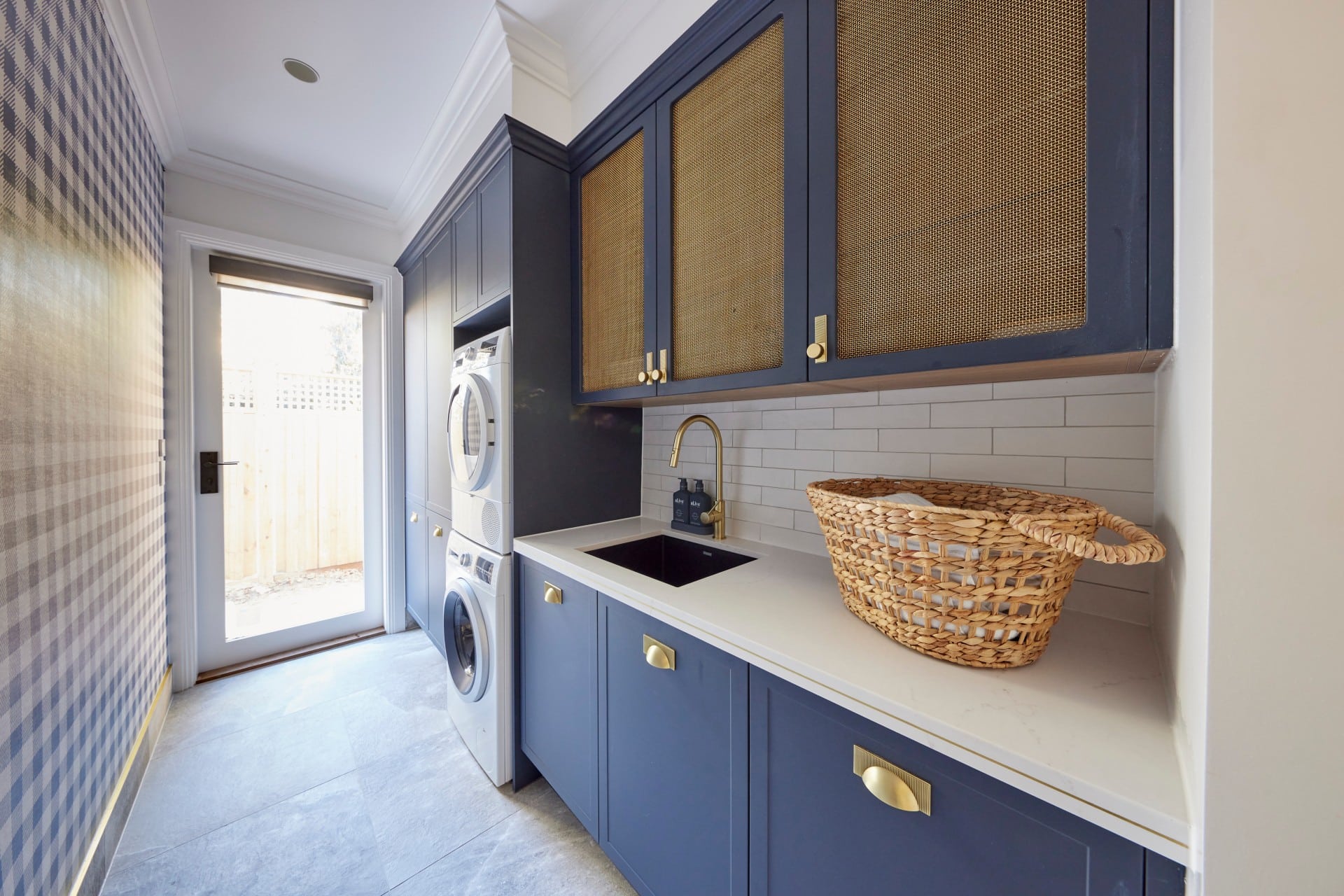 the block 2021 kirsty and jesse blue and gold hamptons laundry with gingham wallpaper