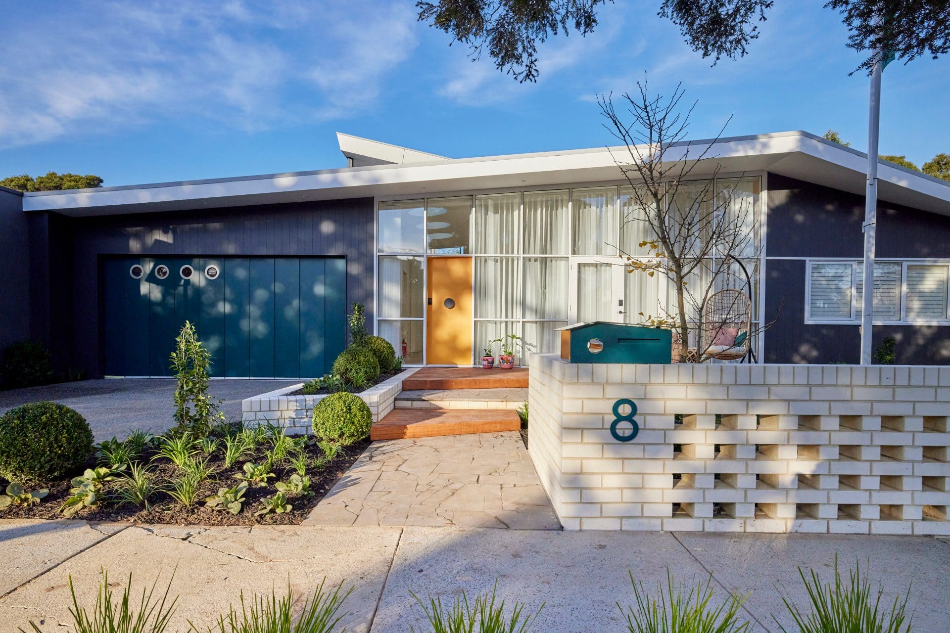 the block 2021 tanya and vito front yard mid century home facade with sloping roof