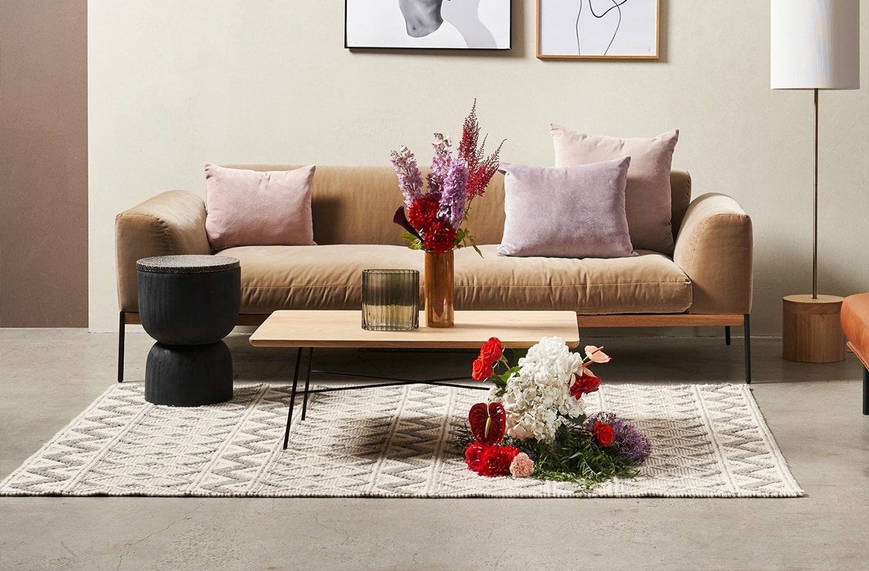 modern living room with beige sofa and bayliss rug trit house