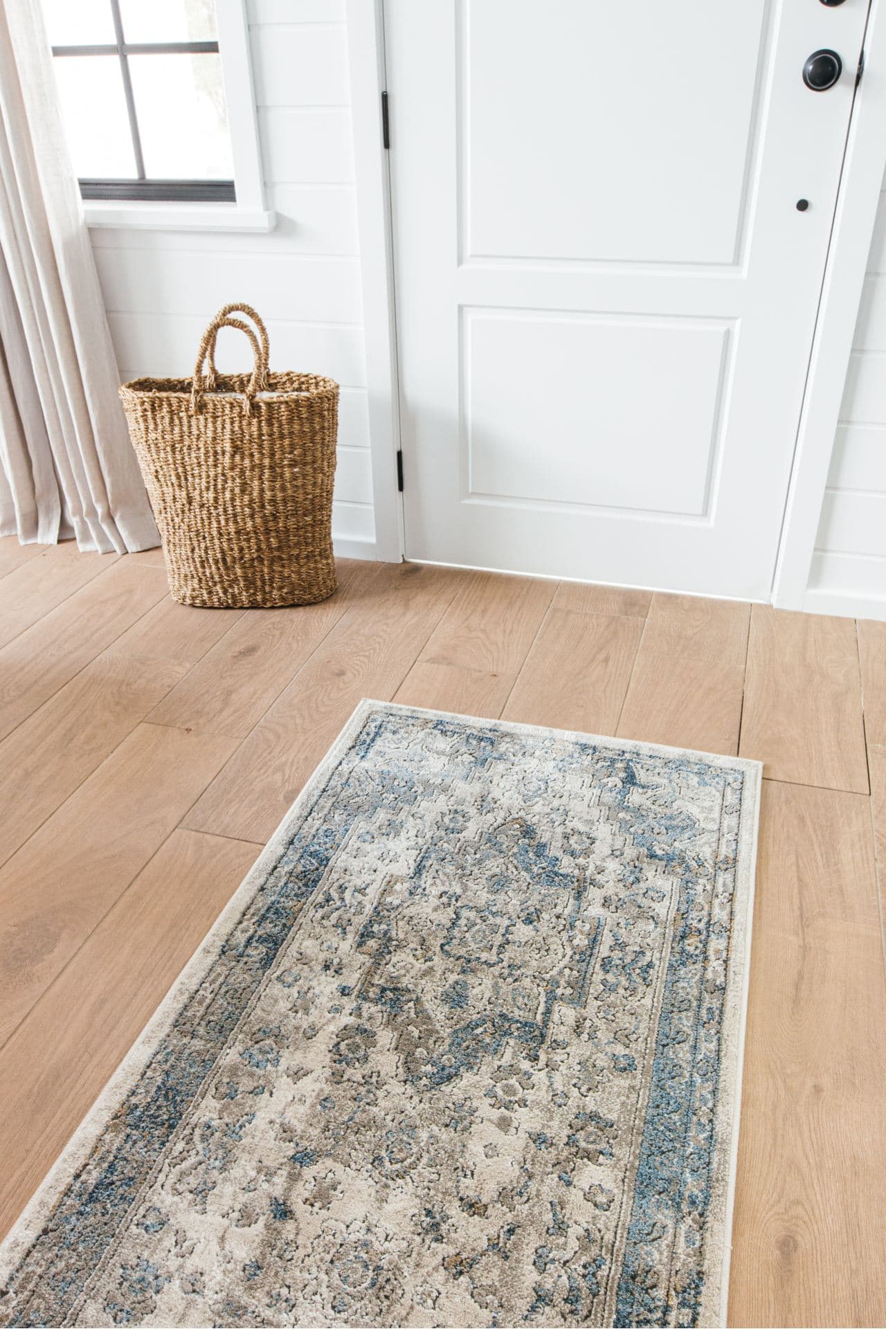 transitional floor runner in long narrow hallway decoratign light oak hardwood floors