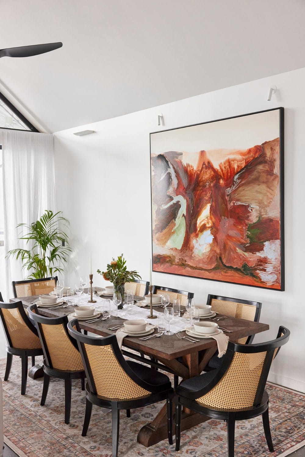 the block 2022 omar and oz dining room with black rattan dining chairs