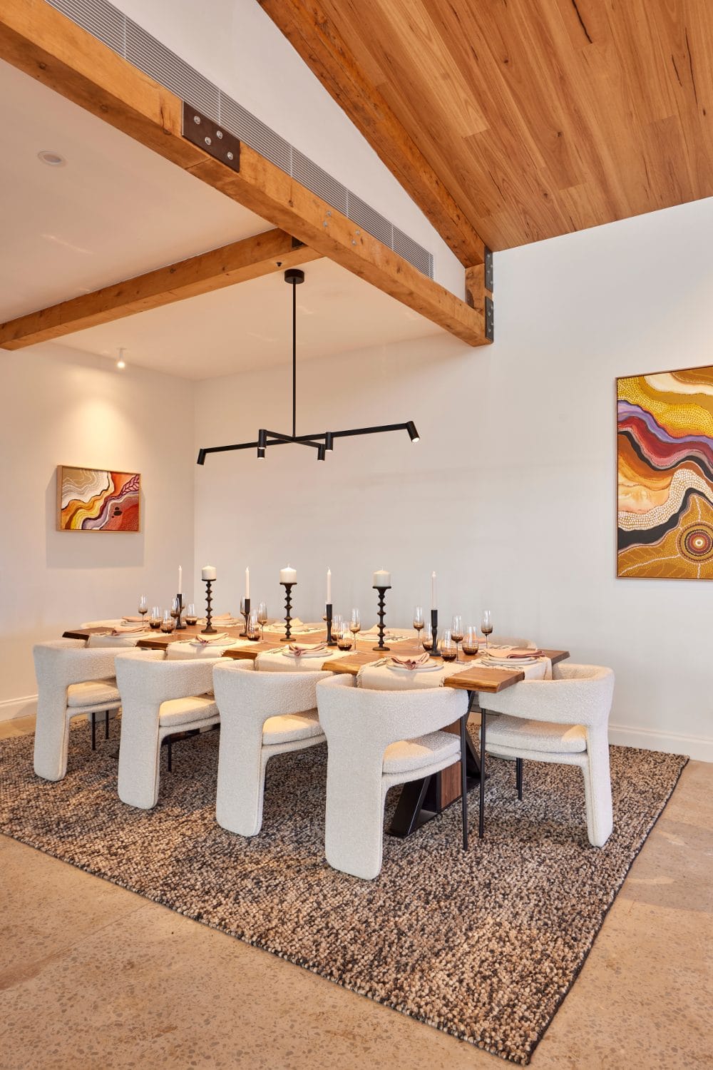 the block 2022 rachel and ryan dining room with curved white boucle dining chairs