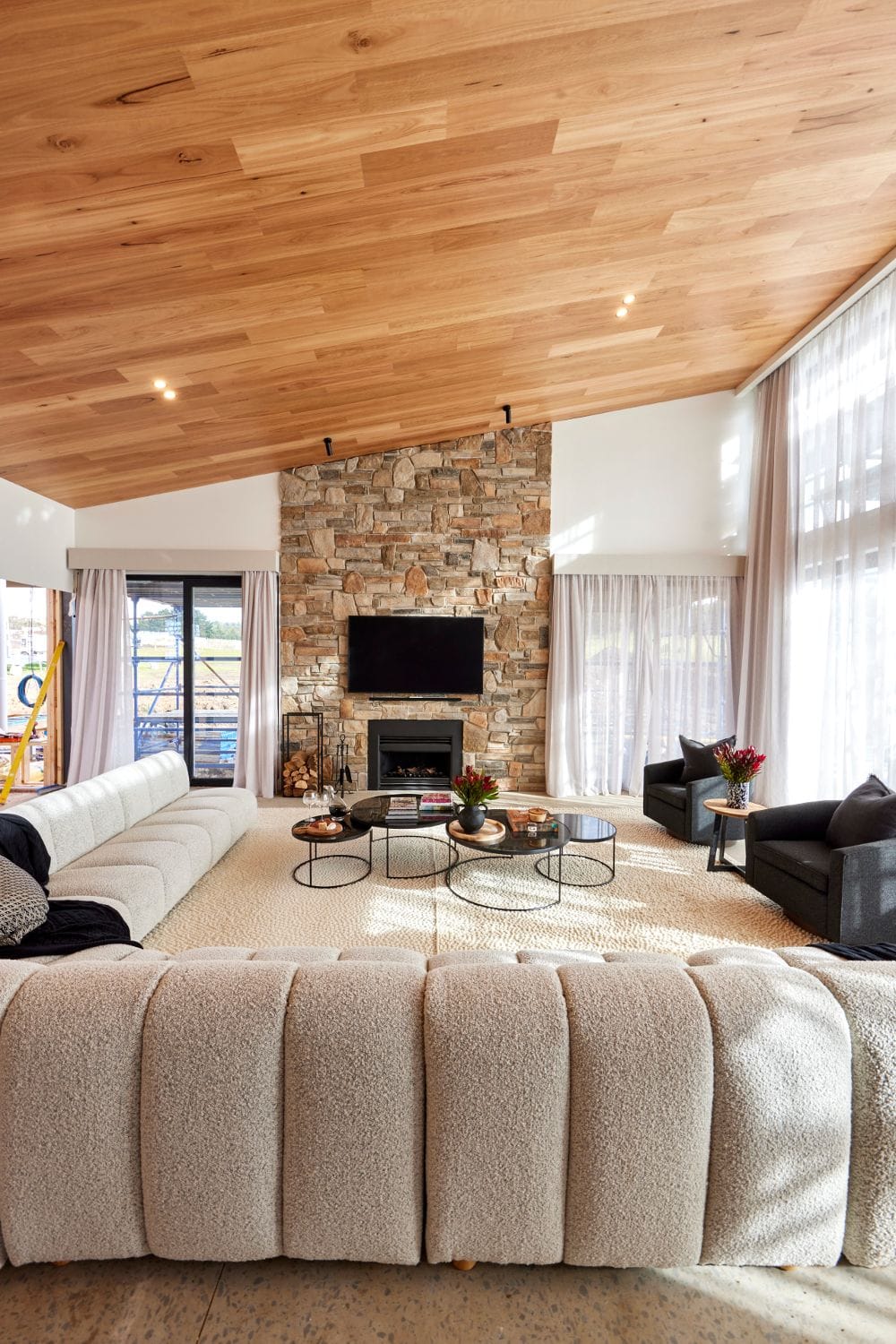 the block 2022 rachel and ryan living room with sloping timber ceiling