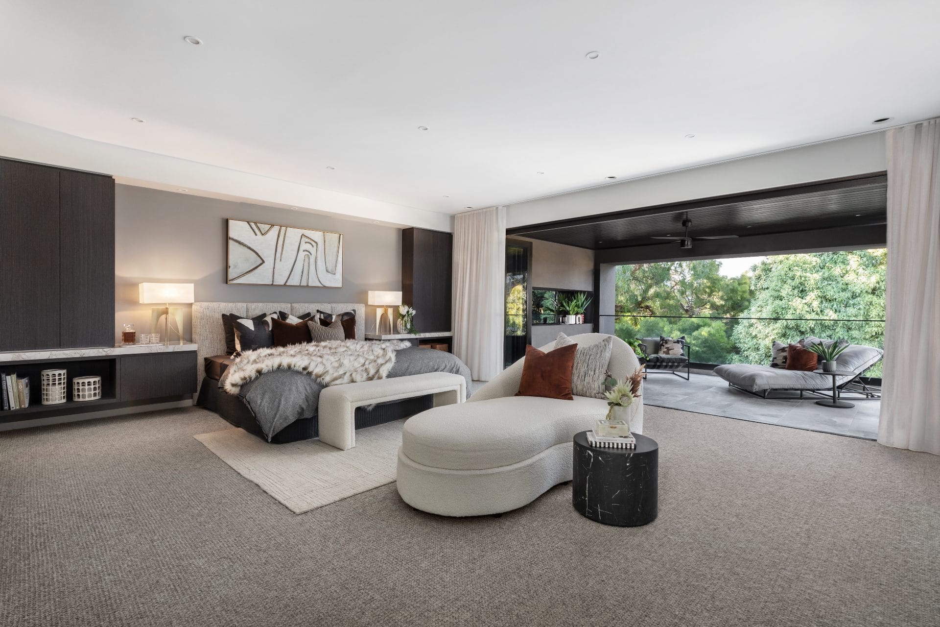 hotel look master bedroom with king bed and chaise lounge metricon lumiere