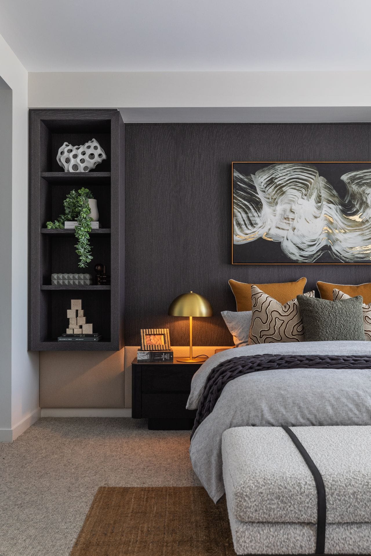 metricon lumiere luxe master bedroom with walnut timber wall panels behind bed