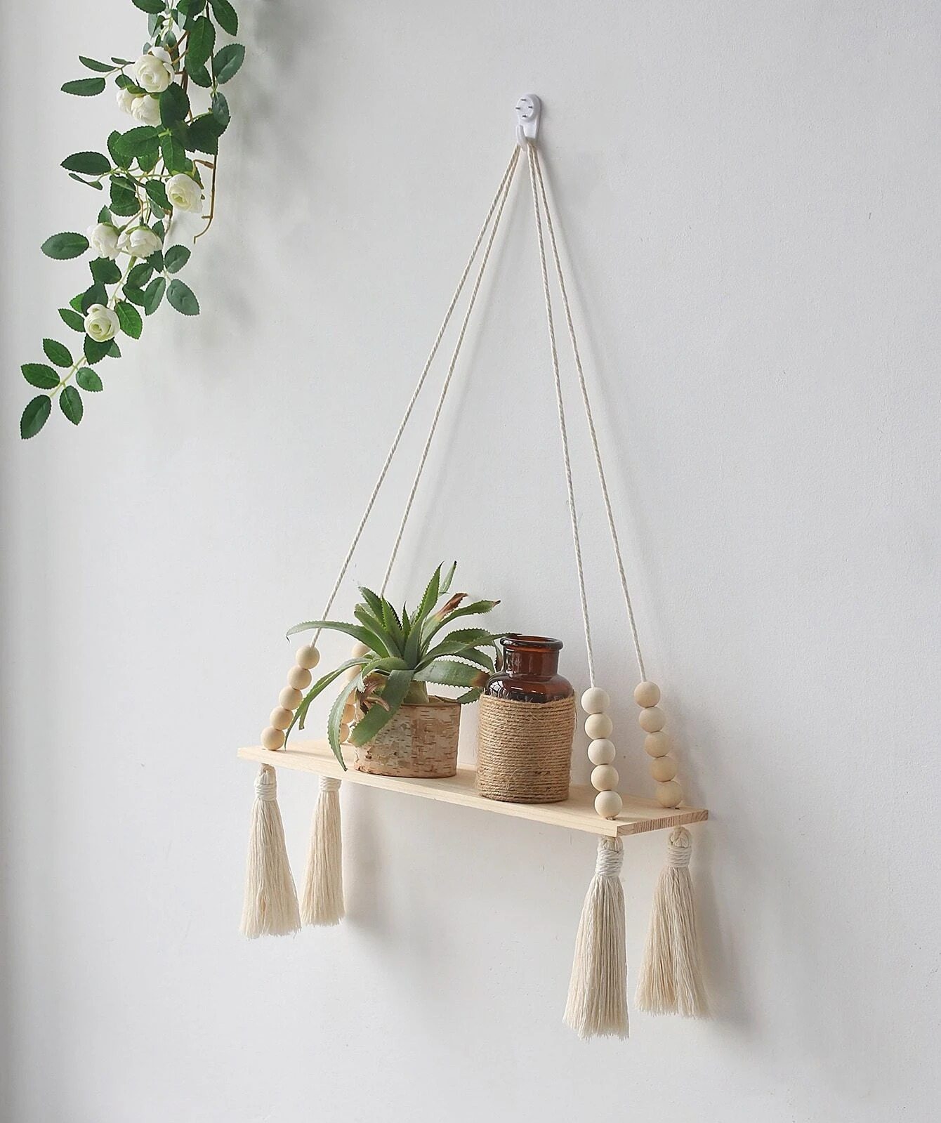 boho wall shelf in rental bedroom decorating with strong and hook