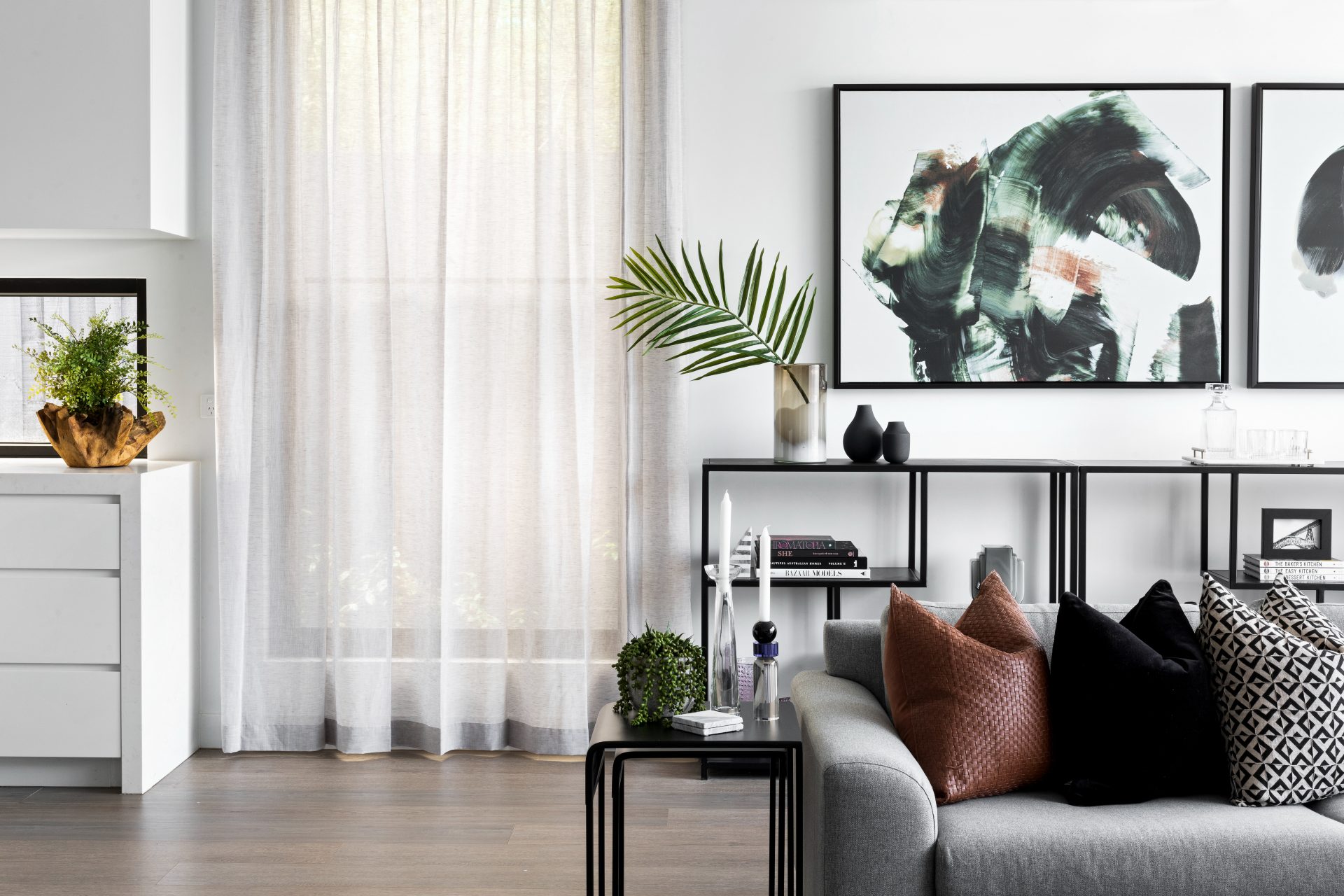 What Does an Interior Designer Do? (Hint: It’s Not Just Picking Cushions) 4 melbourne interior designers tlc interiors modern living room with grey sofa and sheer curtains
