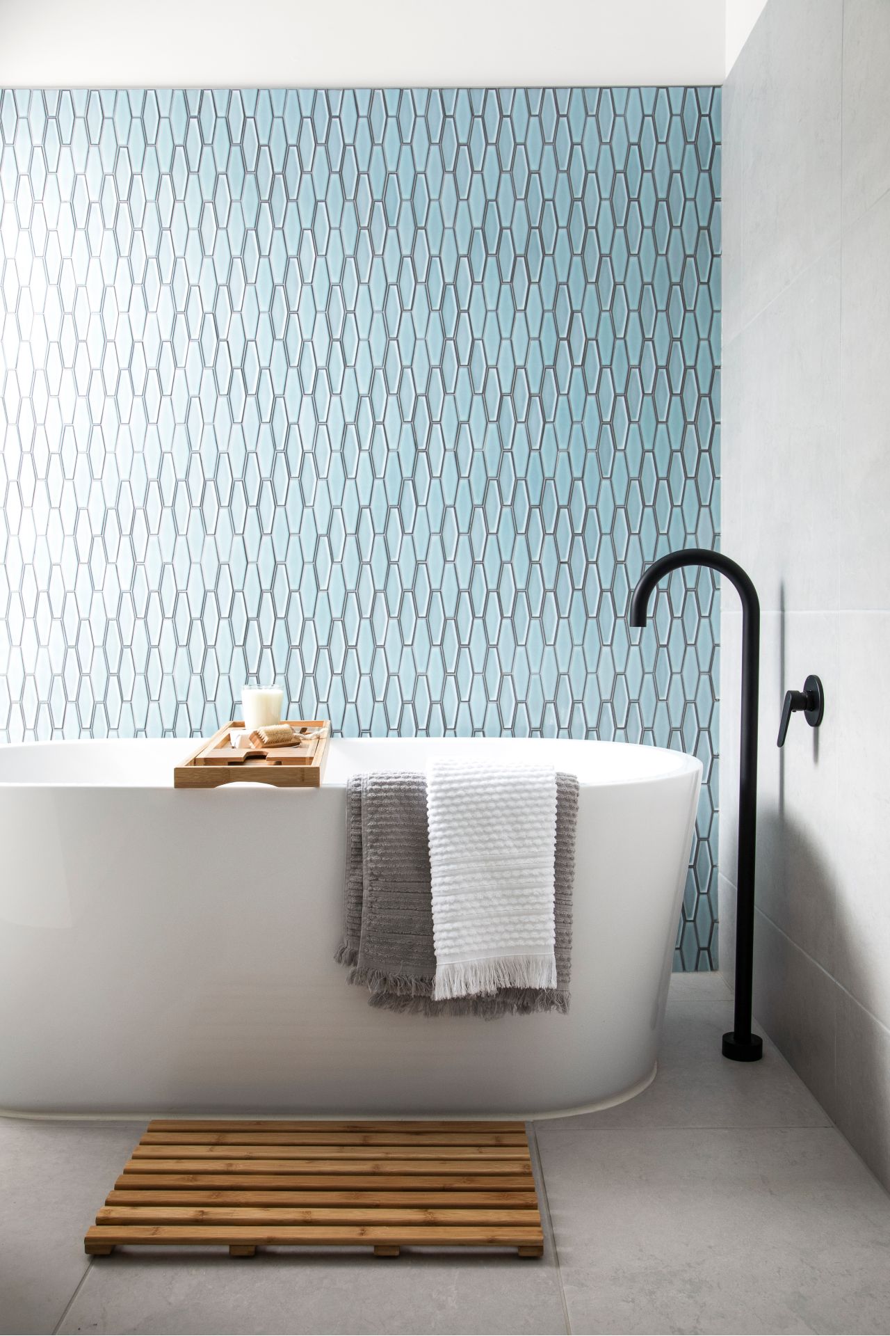 blue mosaic tile bathroom freestanding bath black floor mixer