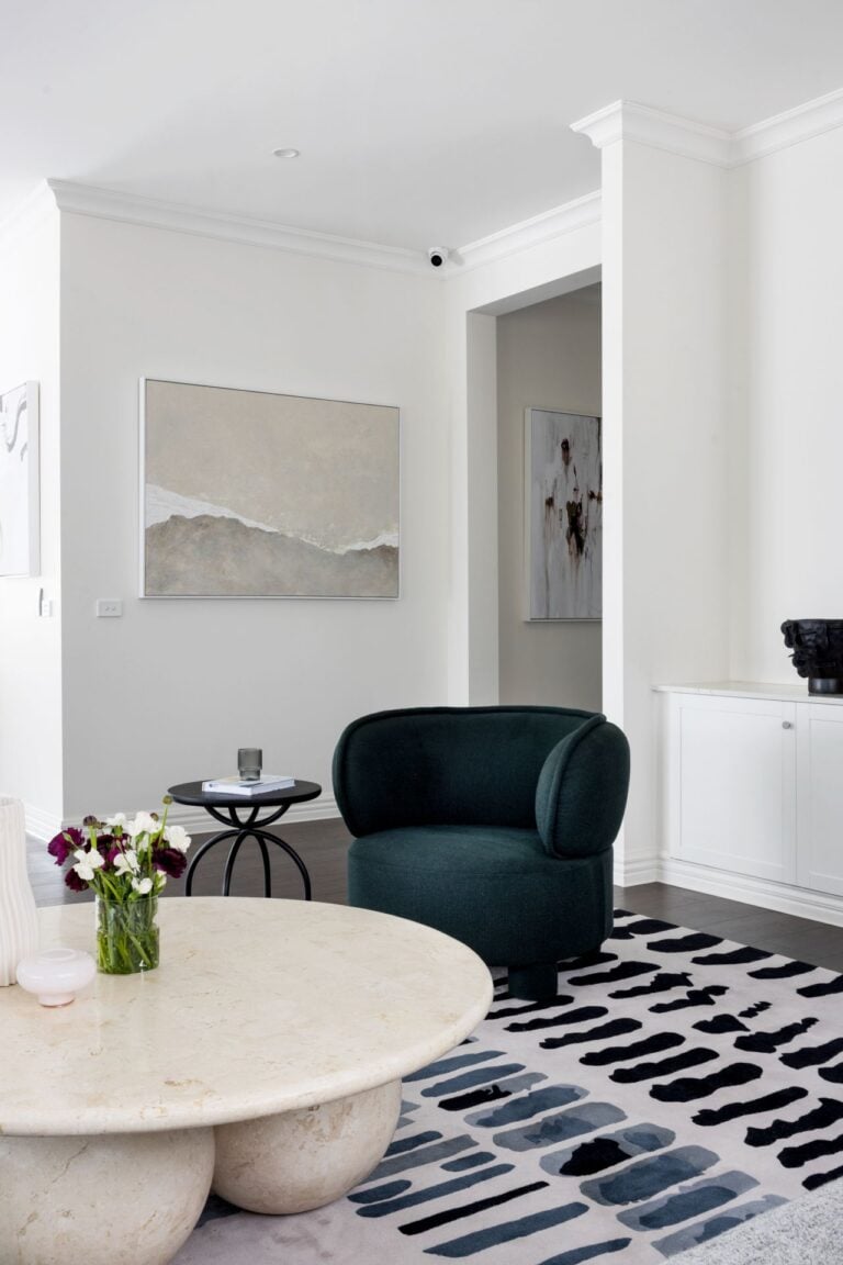 dark teal armchair luxe living room denise quah artwork