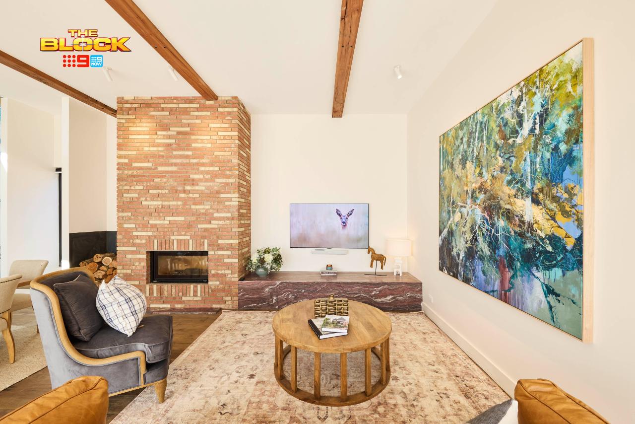 the block 2025 living room reveals sonny and alicia brick fireplace burgundy stone