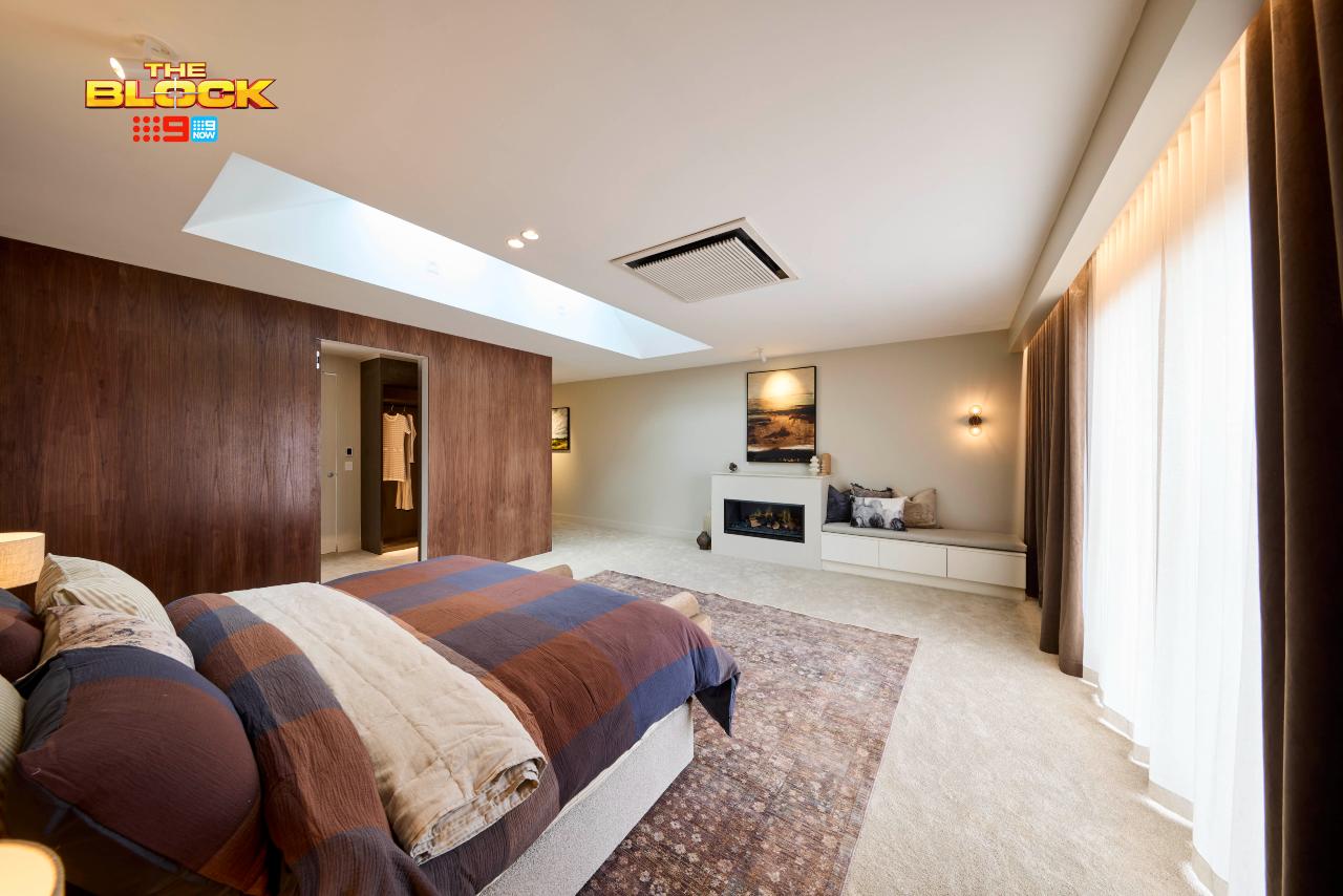 the block 2025 sonny and alicia main bedroom wall paneling and fireplace