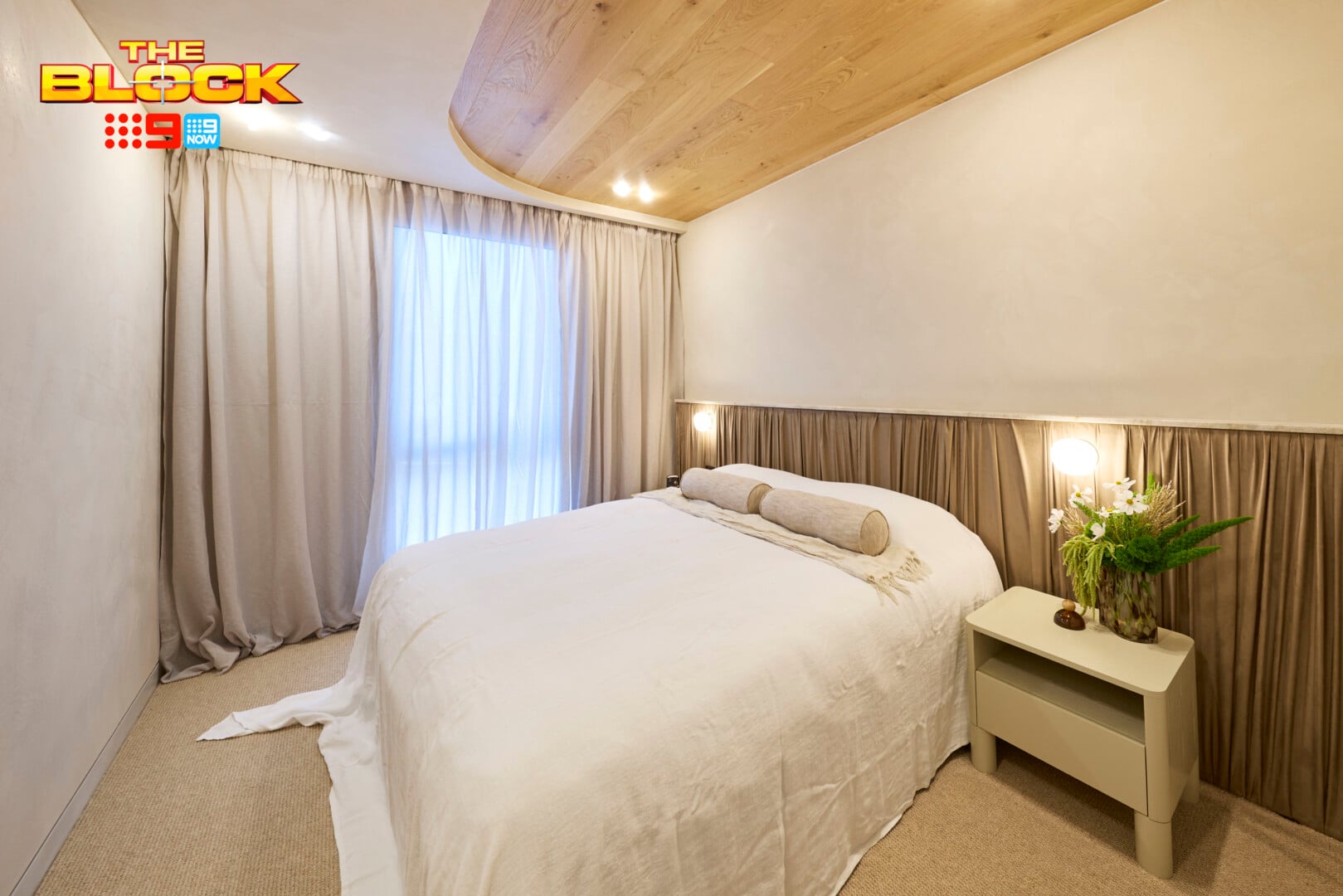 The Block 2026 Guest Bedrooms Reveal: Bland Beginnings for Week One 2 the block 2026 guest bedrooms reveal courtney and sev bed with fabric behind it | TLC Interiors